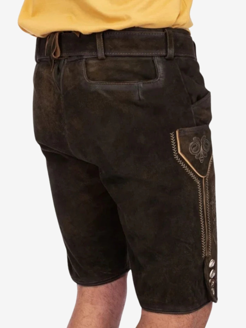 Back and side view of dark brown leather lederhosen showing rear flap, belt loops, and side pocket with decorative stitching.