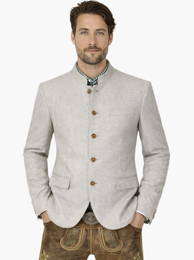Man wearing light grey Bavarian Trachten jacket with stand collar, paired with traditional lederhosen for an authentic Oktoberfest outfit.