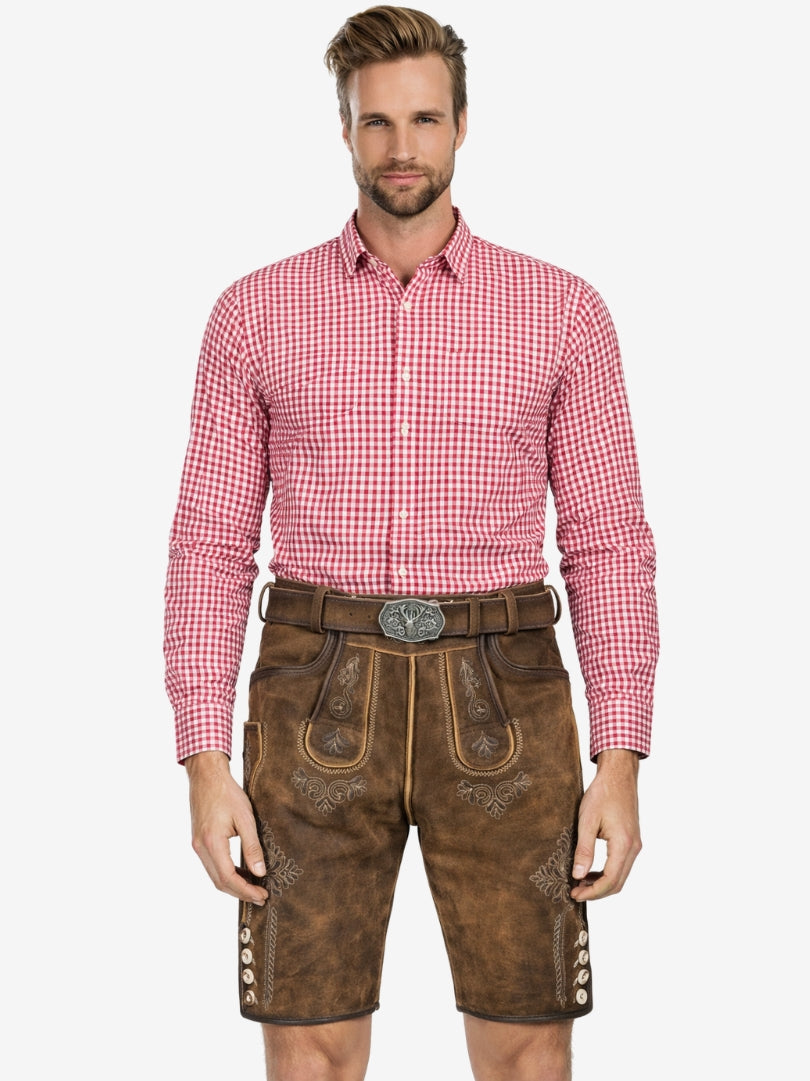 Man wearing brown leather lederhosen shorts with embroidered details and a red checkered shirt.