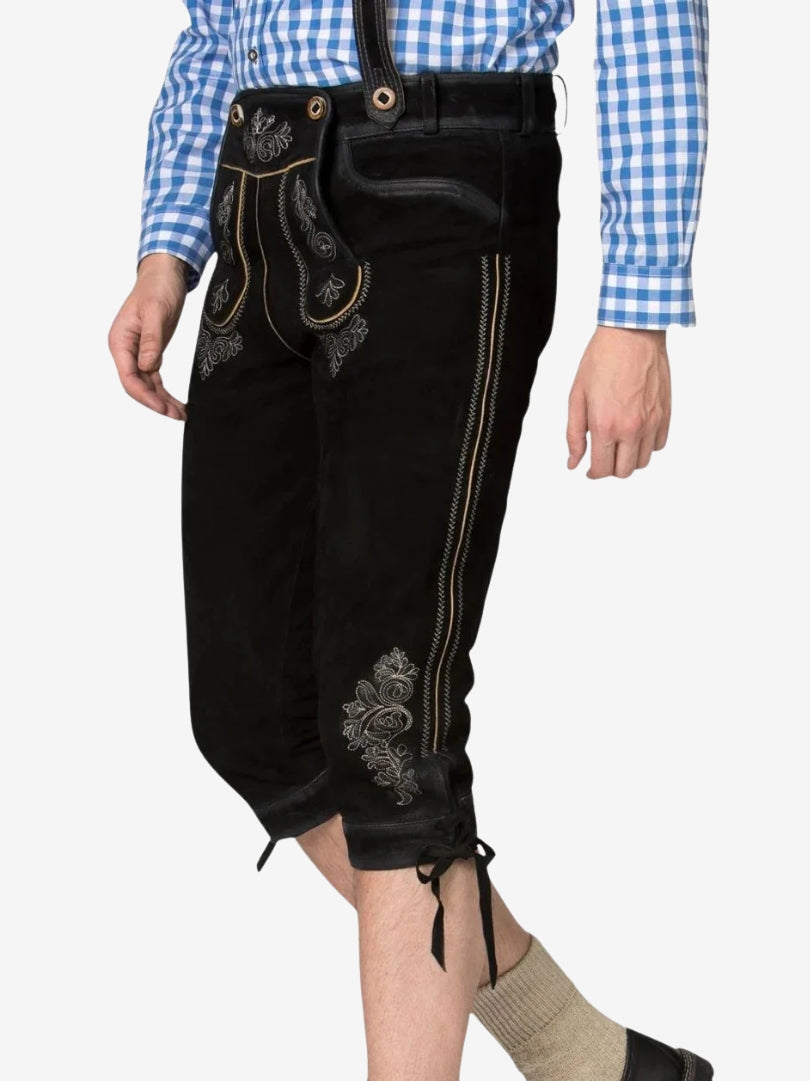 Angled view highlighting texture, embroidery, and stitching along the leg of black bundhosen.