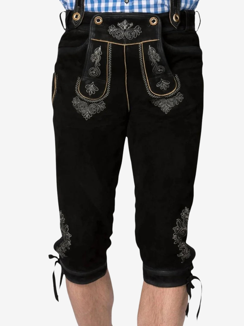 Close-up front view of black bundhosen featuring traditional silver embroidery on the flap and upper thighs.