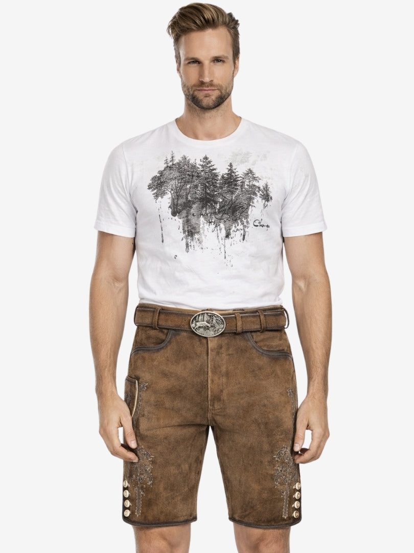 Front view of man wearing brown leather lederhosen shorts with embroidered details, belt, and white graphic t-shirt.