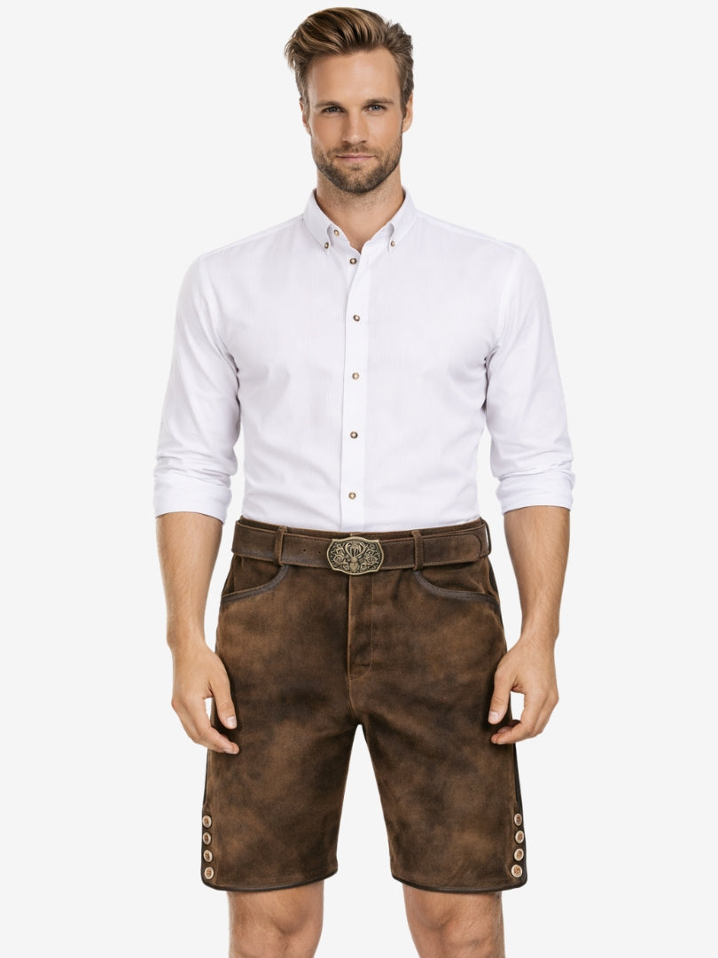 Man wearing plain brown suede lederhosen shorts with a white button-up shirt and a traditional belt featuring a deer motif buckle.