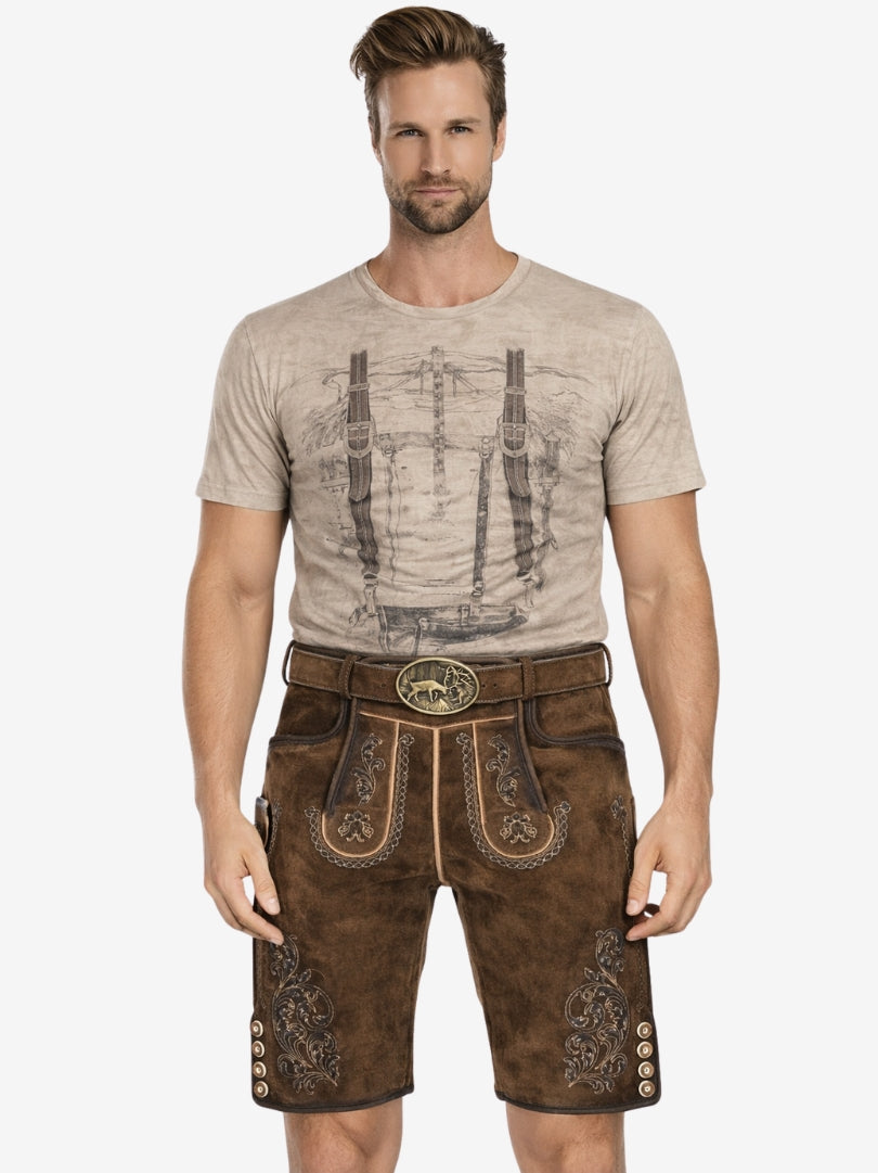 Man wearing dark brown lederhosen with embroidered details, paired with a beige printed t-shirt and a traditional belt.