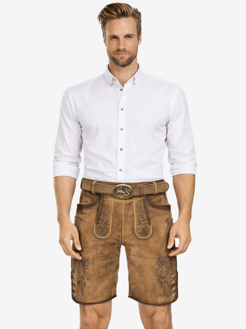 Man wearing tan suede lederhosen with subtle embroidery, paired with a white button-down shirt in traditional Bavarian style.