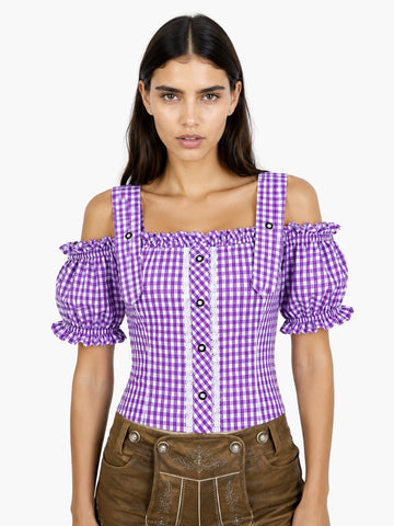 Women’s purple gingham Oktoberfest blouse with puff sleeves, lace panel detail, and fitted bodice paired with traditional lederhosen.