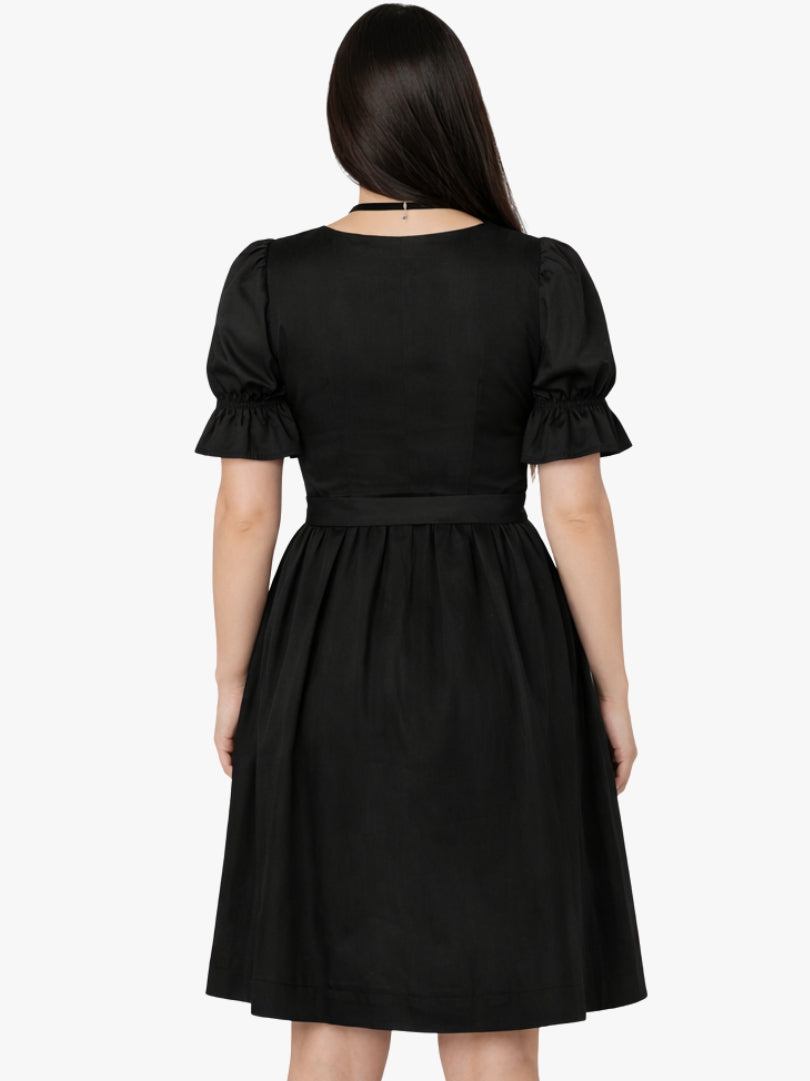 Front view of women's black Bavarian dirndl dress with lace-up bodice, puff sleeves, and traditional Oktoberfest style.