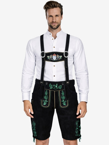 Man wearing black lederhosen with green embroidery and suspenders, paired with a white shirt.