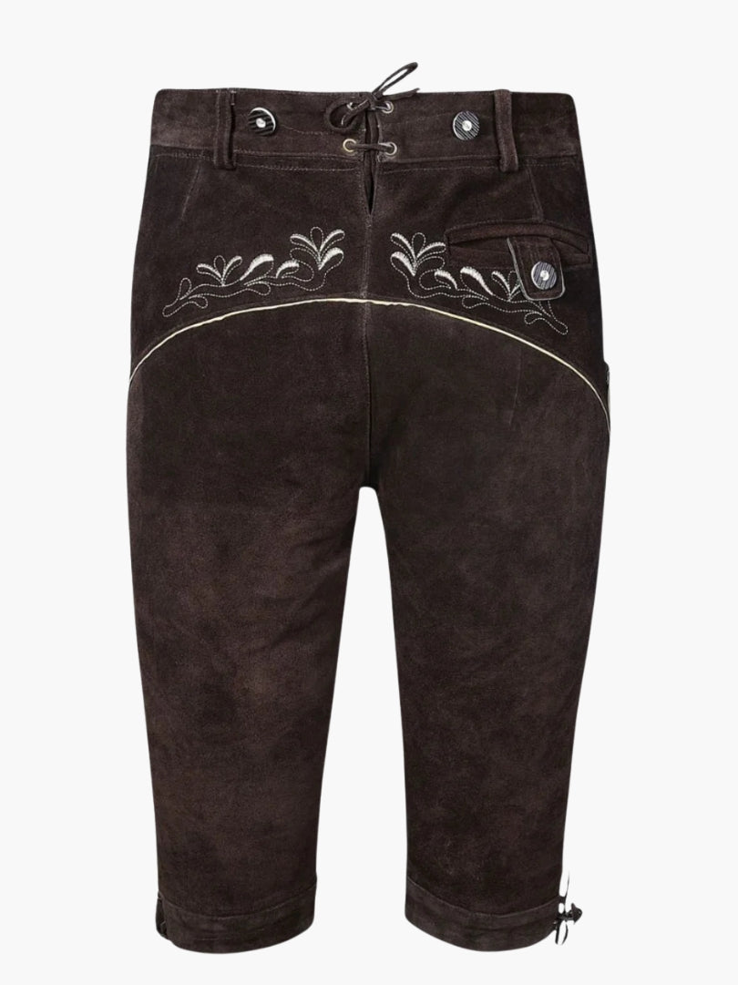 Back view of brown leather bundhosen featuring traditional embroidery across the waistband, lace-up back closure, and a buttoned rear pocket.