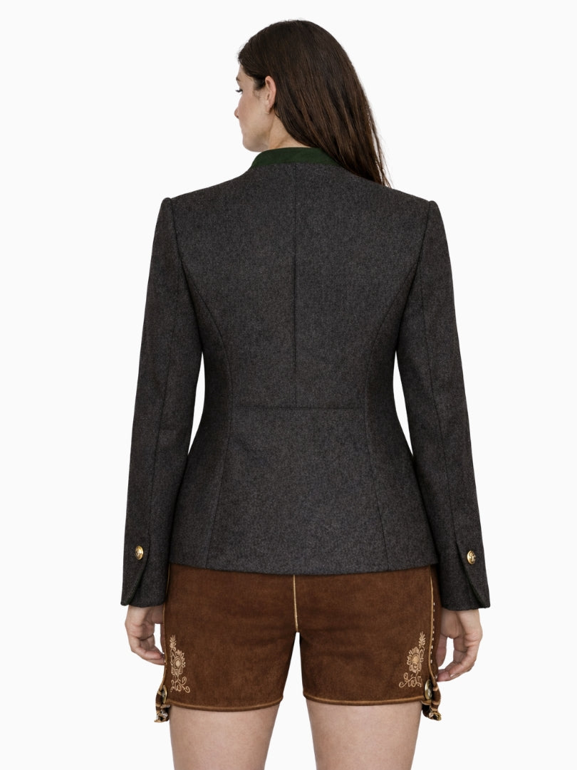 Women’s charcoal Bavarian Trachten jacket with green stand collar, traditional metal buttons, and tailored fit, paired with brown lederhosen shorts, front view.