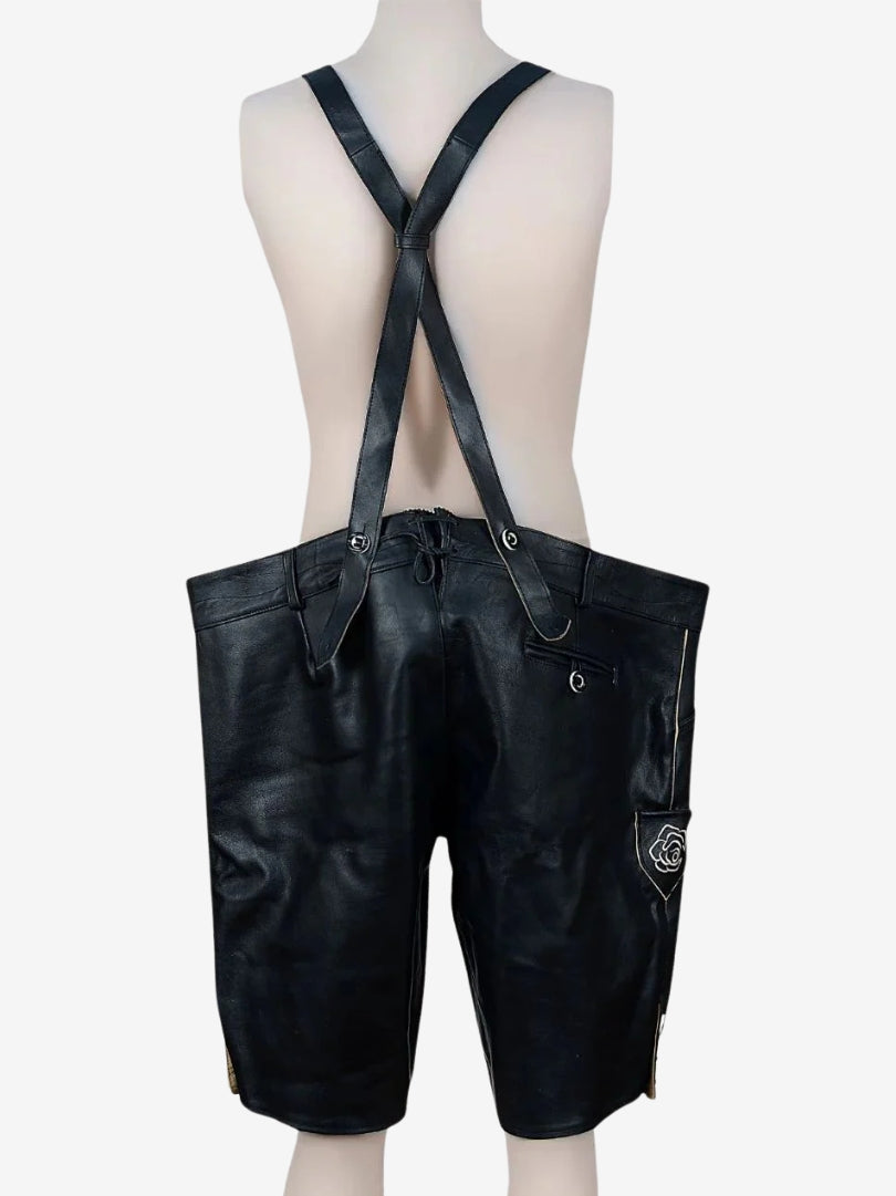 Back view of black lederhosen with crossed suspenders, plain leather finish and rear pocket detail.