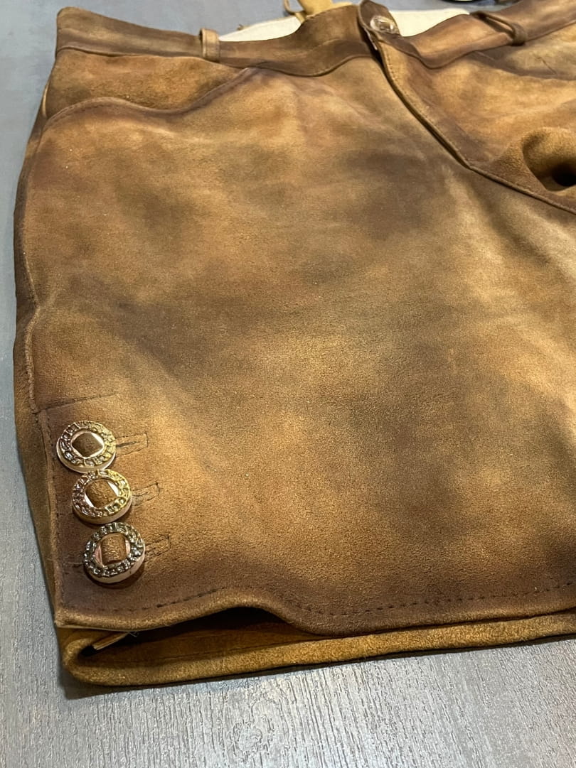 Left side view of Men's Rustic Brown Premium Lederhosen Short featuring traditional horn-style buttons