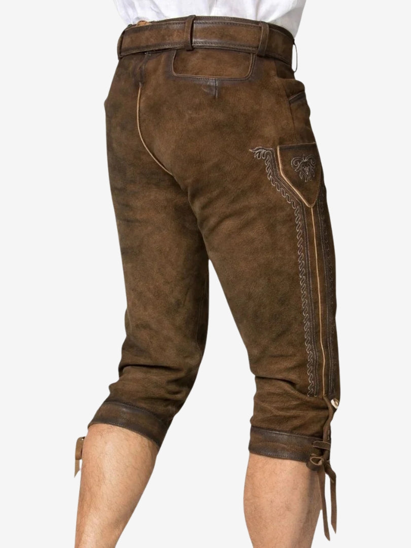 Rear angled view of brown bundhosen highlighting stitching, back fit, and side embroidery detail.