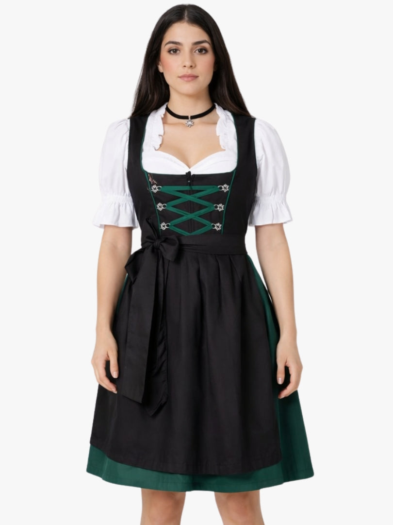 Front view of women's black and green Bavarian dirndl dress with white blouse, lace-up bodice, and black apron for Oktoberfest.