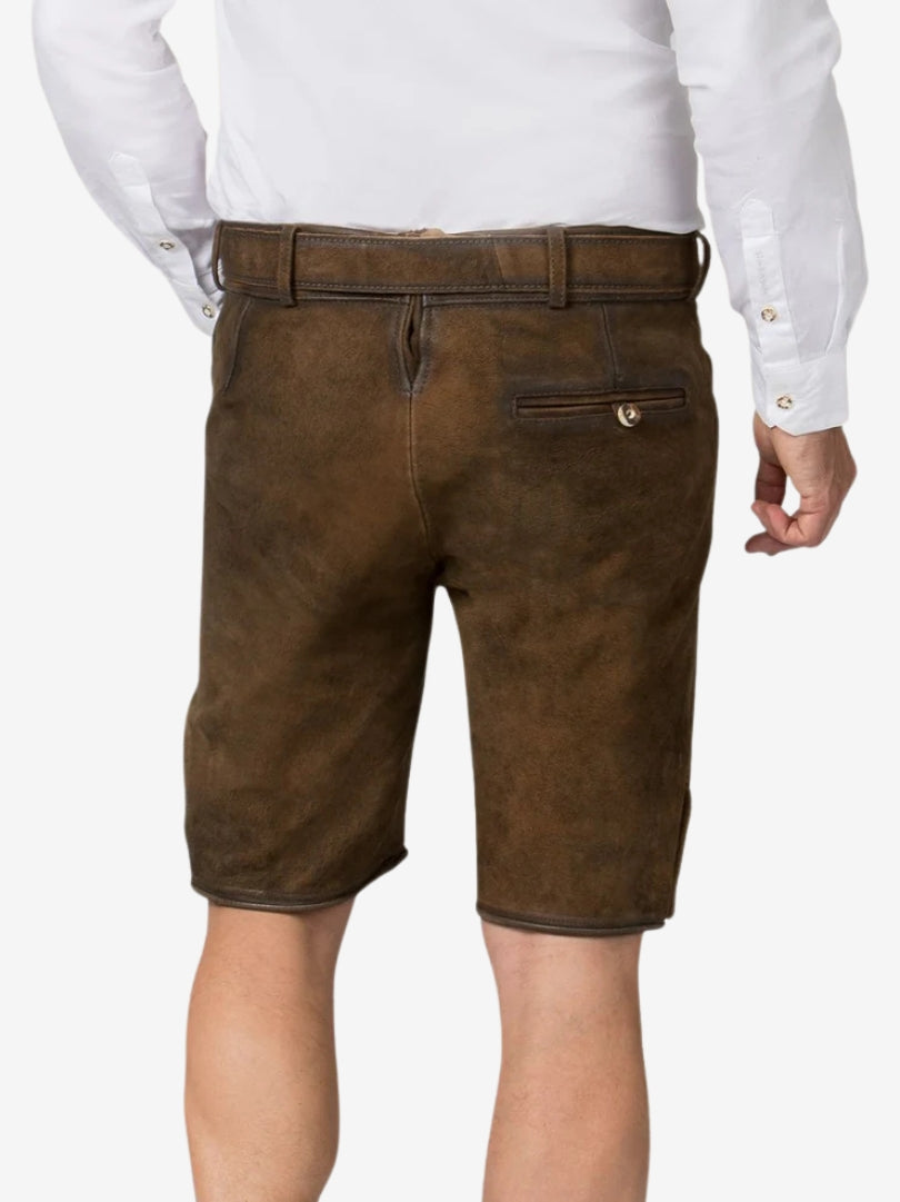 Back view of brown suede lederhosen shorts showing a single buttoned back pocket, belt loops, and smooth minimal design.