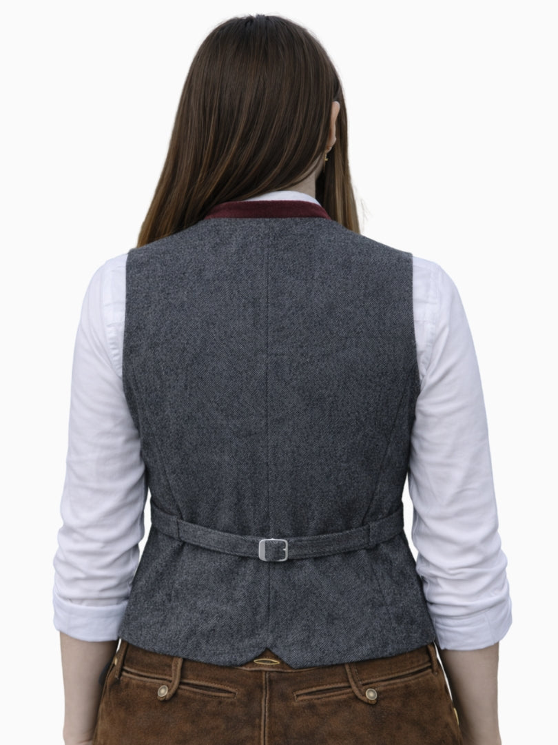Back view of women's Bavarian Trachten vest with grey textured fabric, adjustable waist belt, and tailored traditional fit.
