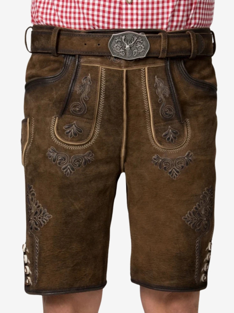 Close-up front view of brown lederhosen with decorative embroidery and traditional belt buckle.