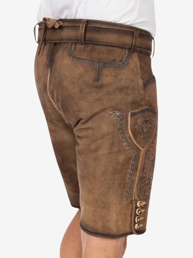 Side view of brown suede lederhosen shorts showing detailed embroidery and traditional pocket design.