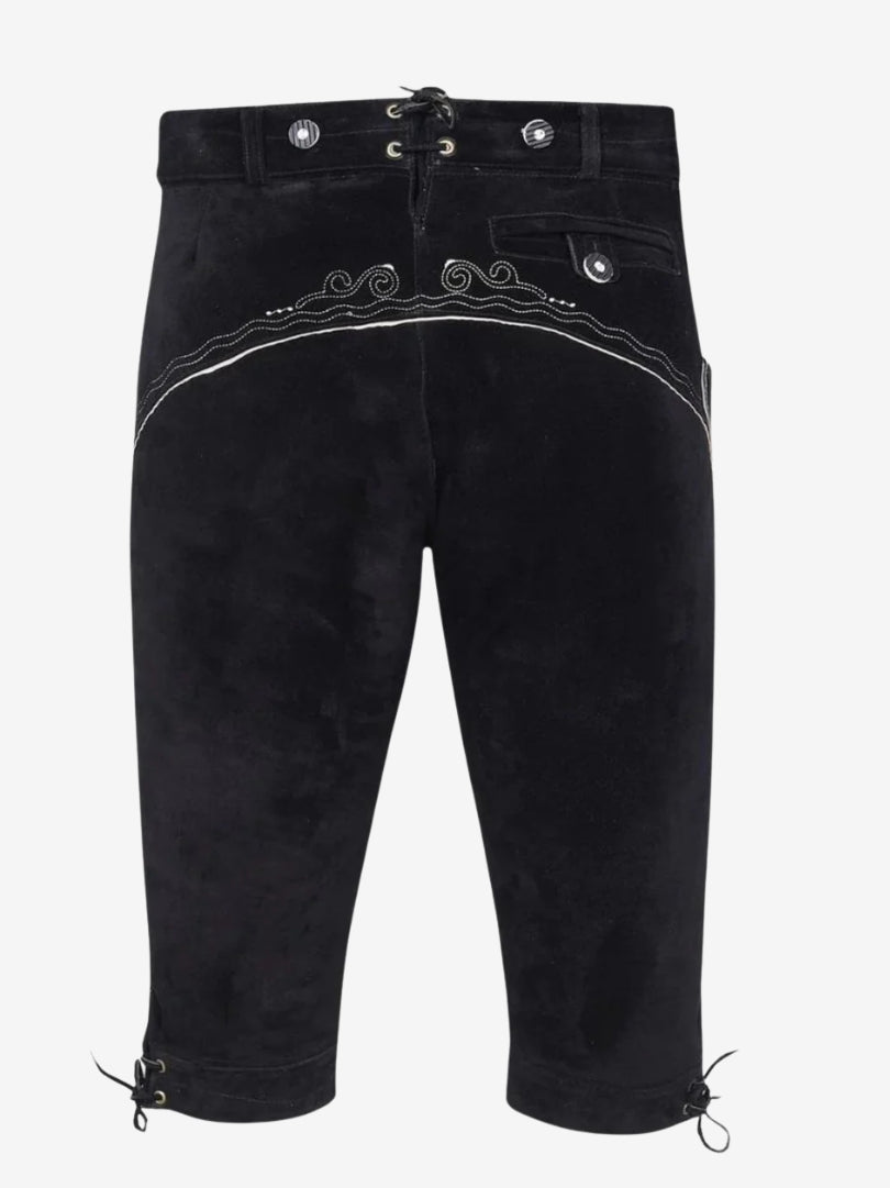 Back view of black bundhosen showing decorative stitching across the seat, buttoned pocket, and lace-up closure at the waist.