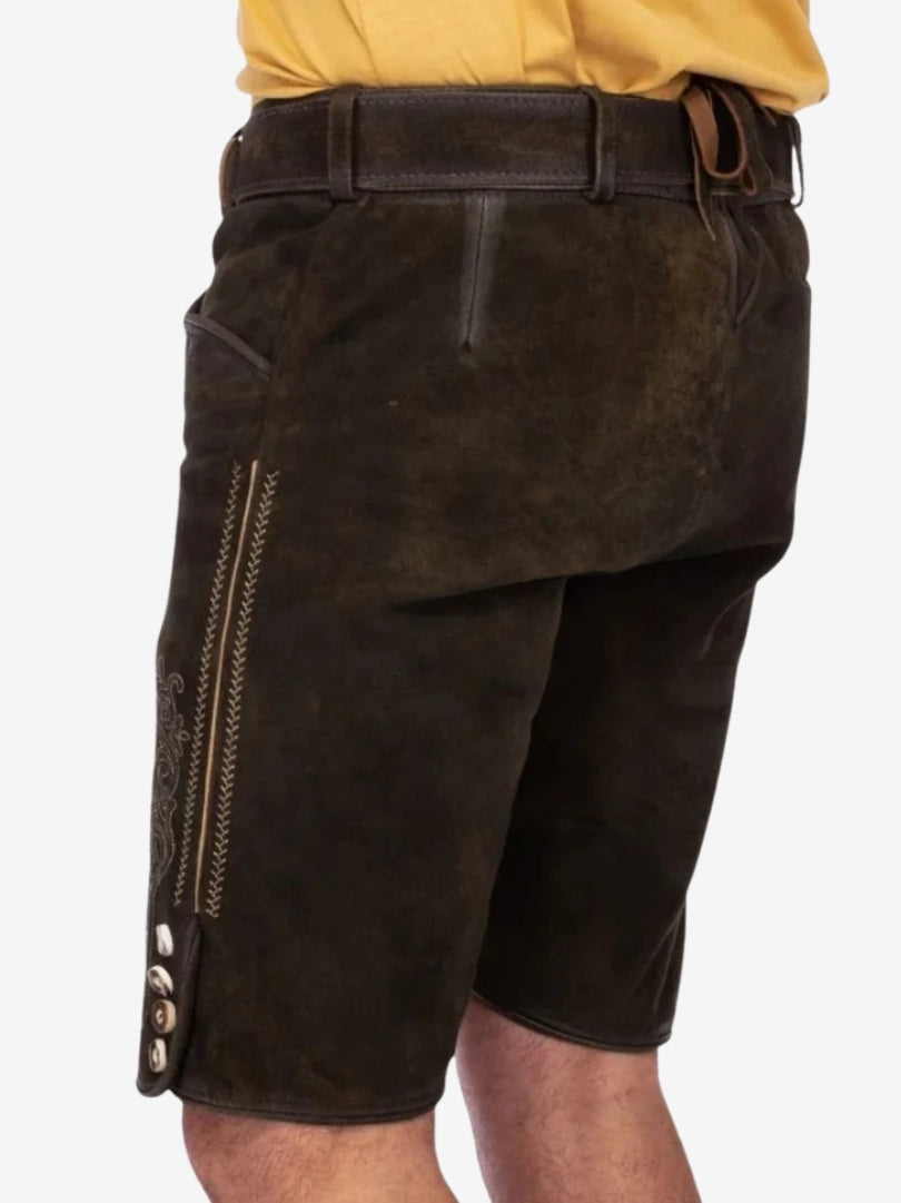 Rear view of dark brown lederhosen highlighting smooth leather texture, back flap, and minimal stitching details.