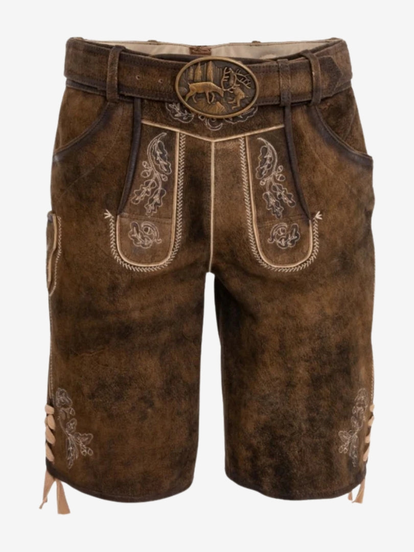 Front view of brown suede lederhosen shorts with decorative embroidery, classic flap design, and belt with an engraved deer motif buckle.