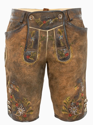 Front view of rustic brown traditional lederhosen-style shorts featuring colorful floral embroidery, decorative front flap with buttons, and a textured leather finish.