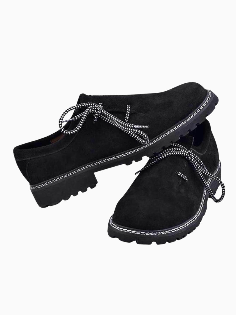 Men’s black suede Trachten shoes with side laces and thick grip sole, traditional Oktoberfest footwear.