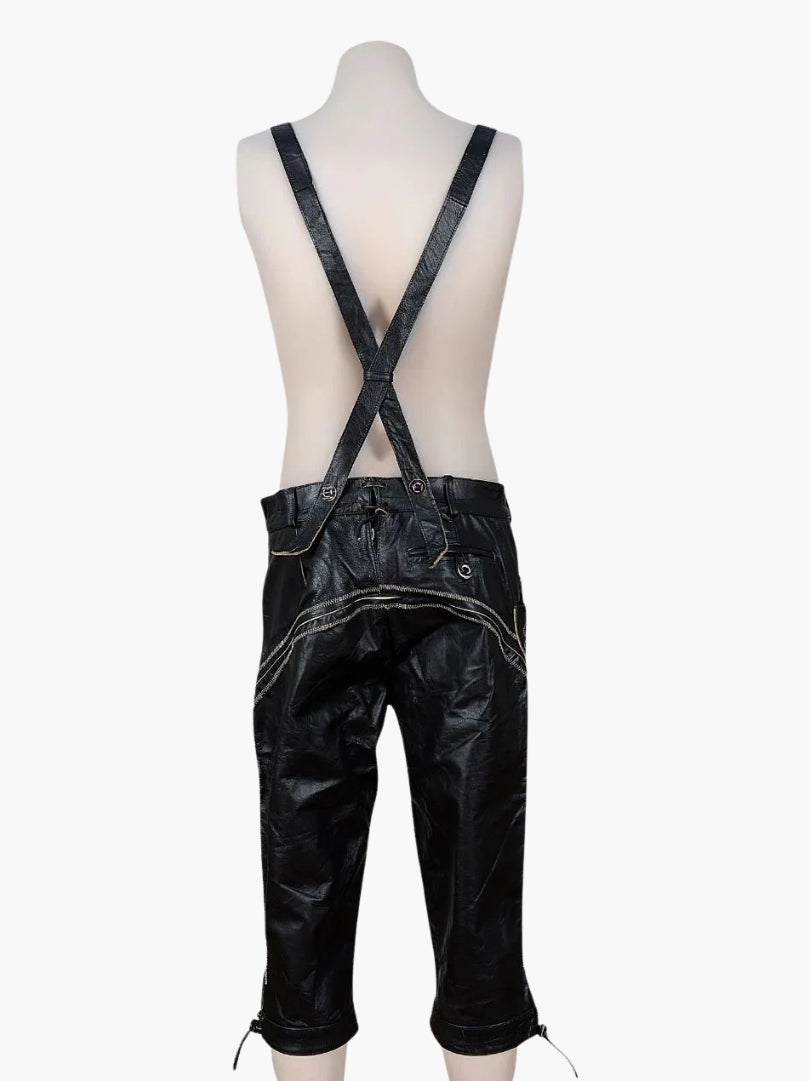 Rear view of black leather bundhosen with crossed suspenders, lace-up back closure, and decorative stitching across the seat.