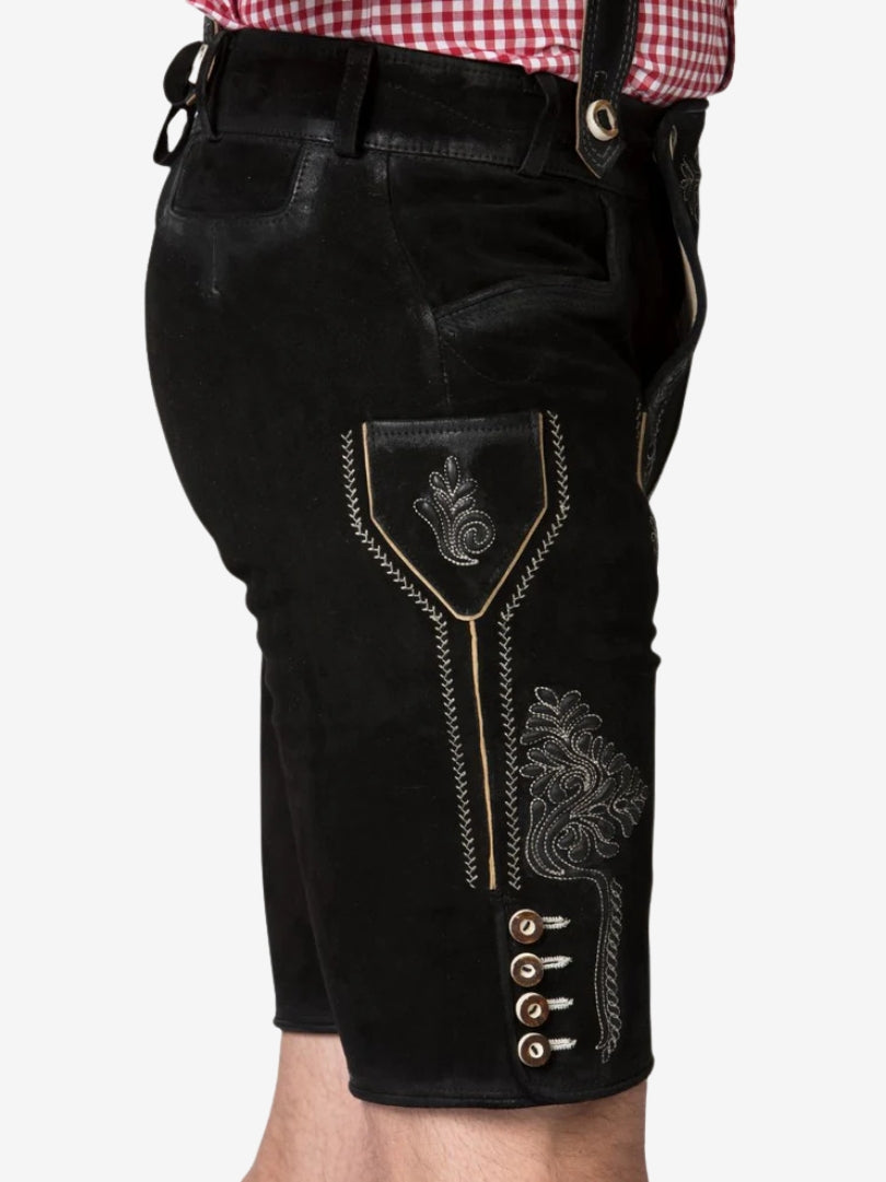 Side view of black suede lederhosen with white embroidery, featuring a side pocket, decorative stitching, and traditional buttons along the hem.