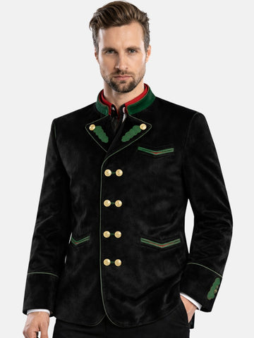 Man wearing black velvet Bavarian Trachten jacket with green trim and bone buttons