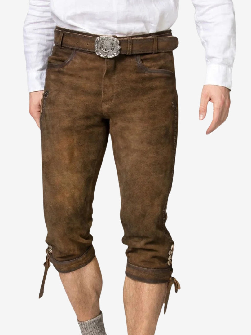 Close-up front view of brown bundhosen featuring belt with decorative buckle and front pocket design.