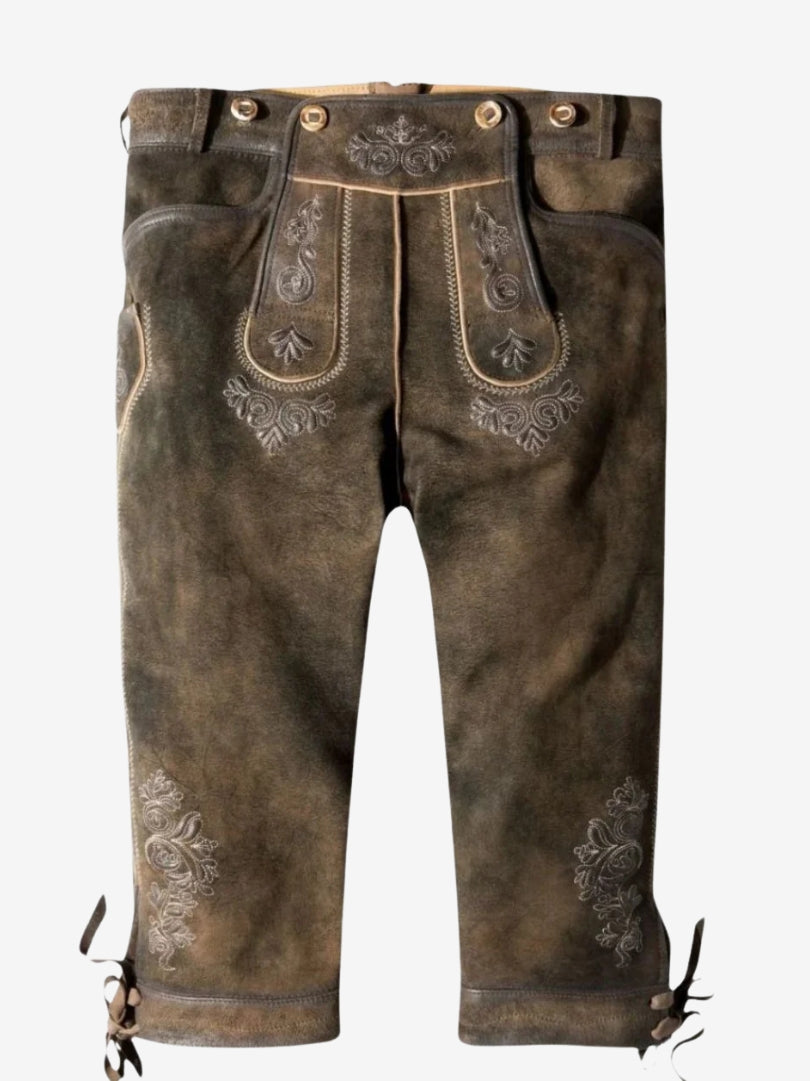 Brown leather bundhosen displayed without model, highlighting embroidered front panel and knee-length design with ties.