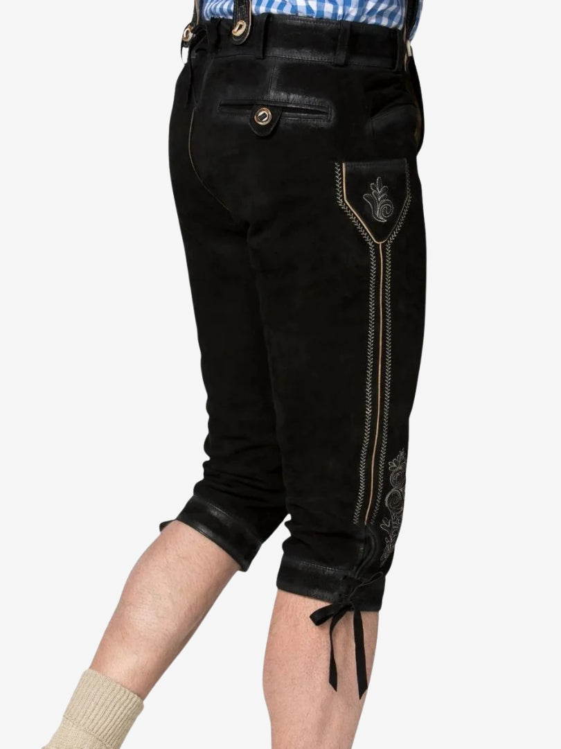 Rear side view of black bundhosen highlighting back pocket, stitching, and adjustable knee ties.