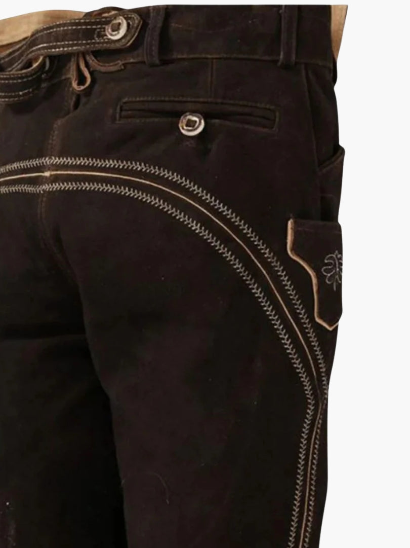 Rear side view of brown bundhosen showing decorative curved stitching, buttoned back pocket, and side utility pocket.