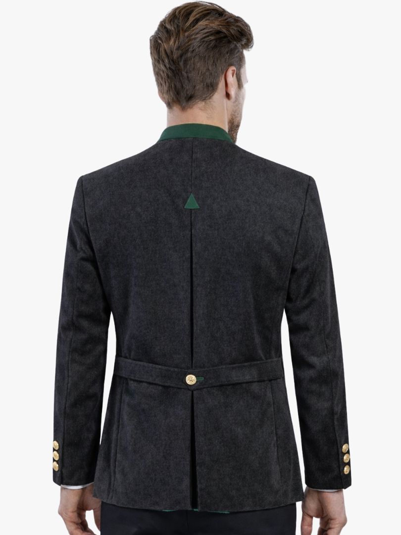 Man wearing charcoal wool Bavarian Trachten jacket with green trim and traditional buttons