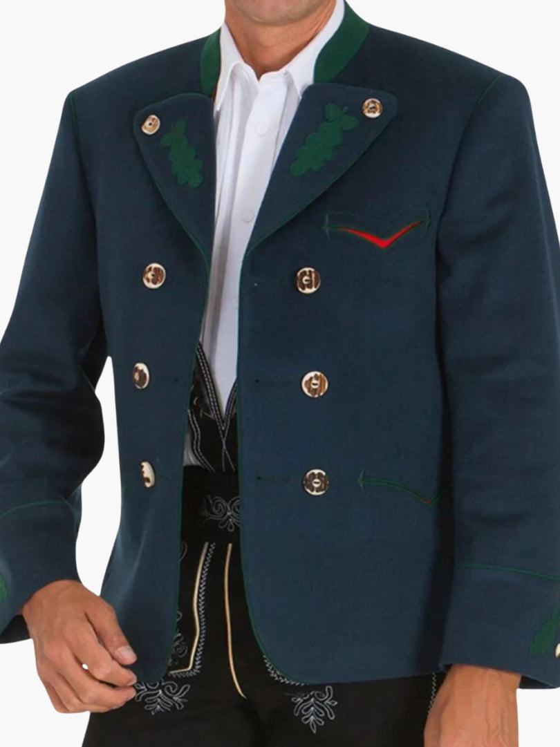 Close-up of navy Bavarian jacket showing gold-tone buttons, green embroidered lapels, and classic double-breasted design with white shirt.