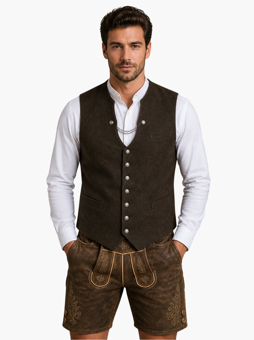 Men’s traditional brown Alpine vest with button front, styled over white shirt and worn with detailed Bavarian lederhosen for Oktoberfest.