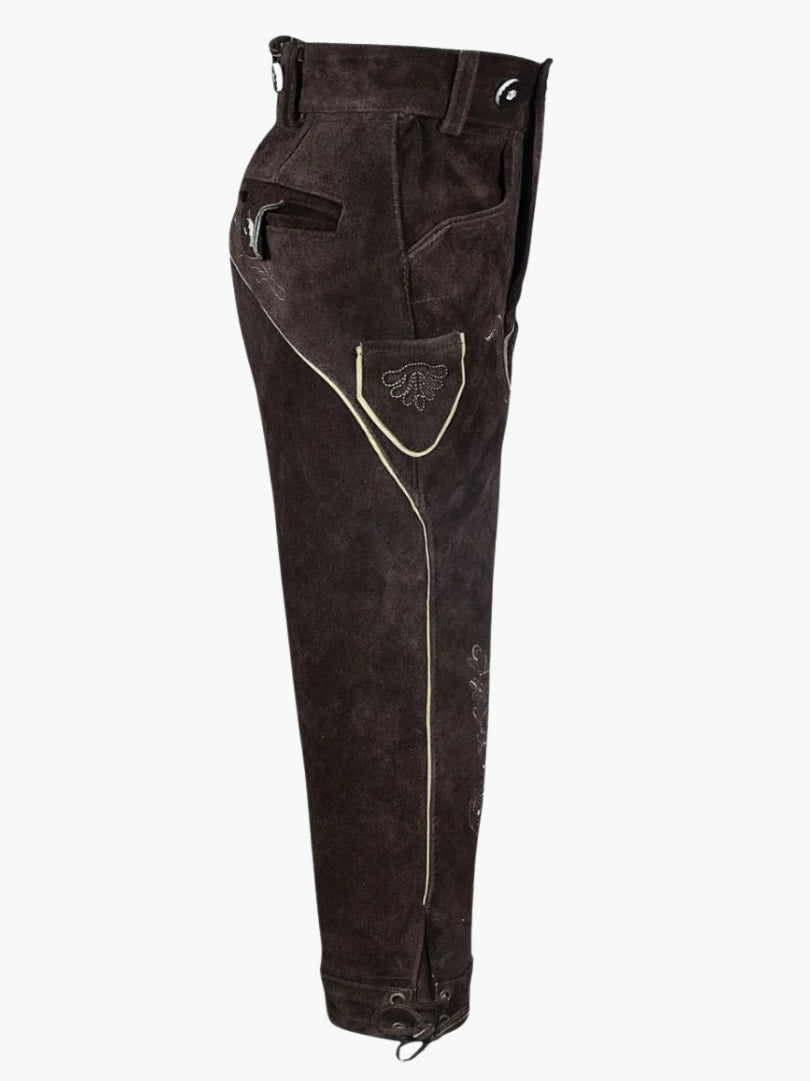 Side profile of brown leather bundhosen highlighting side pocket, decorative stitching, and knee-length cut with lace-up fastening.