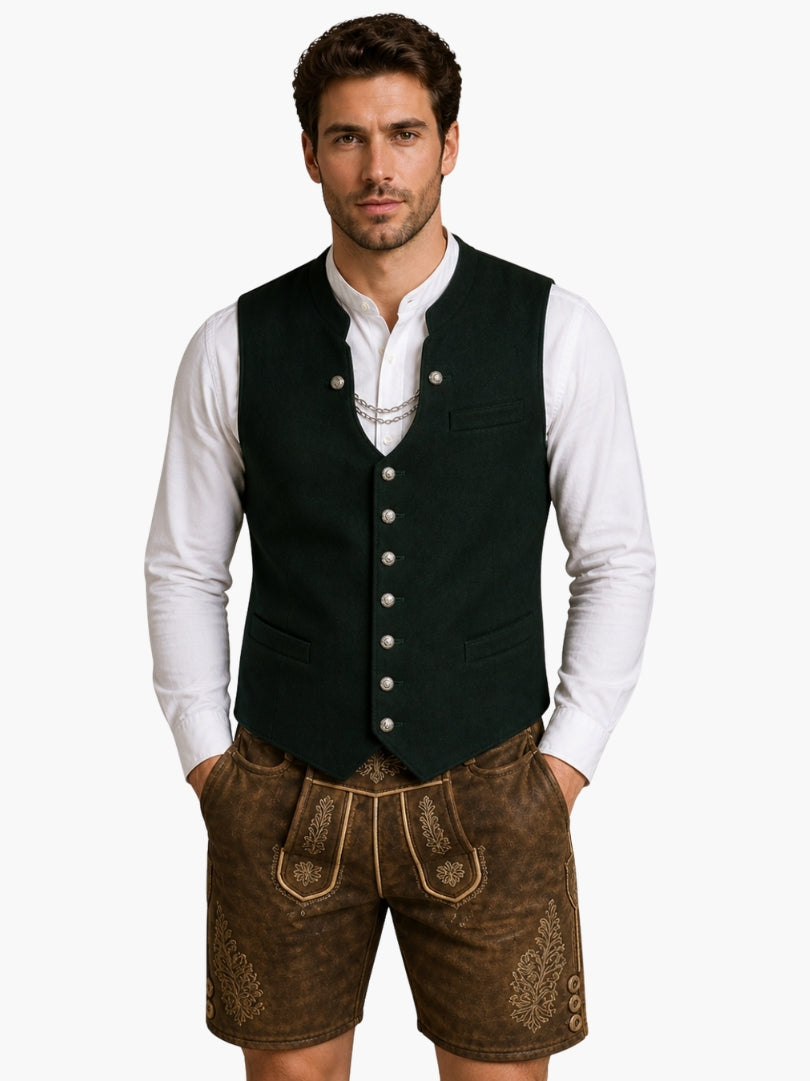 Men’s dark green Oktoberfest vest with traditional buttons, worn over white shirt and paired with brown leather lederhosen.