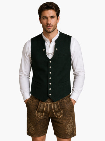 Men’s dark green Oktoberfest vest with traditional buttons, worn over white shirt and paired with brown leather lederhosen.