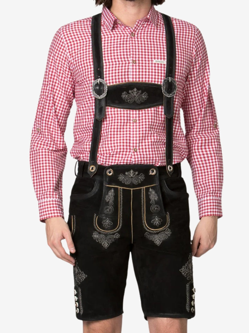 Man in traditional Bavarian outfit with black lederhosen, suspenders, and a red gingham shirt, shown from chest to knees.