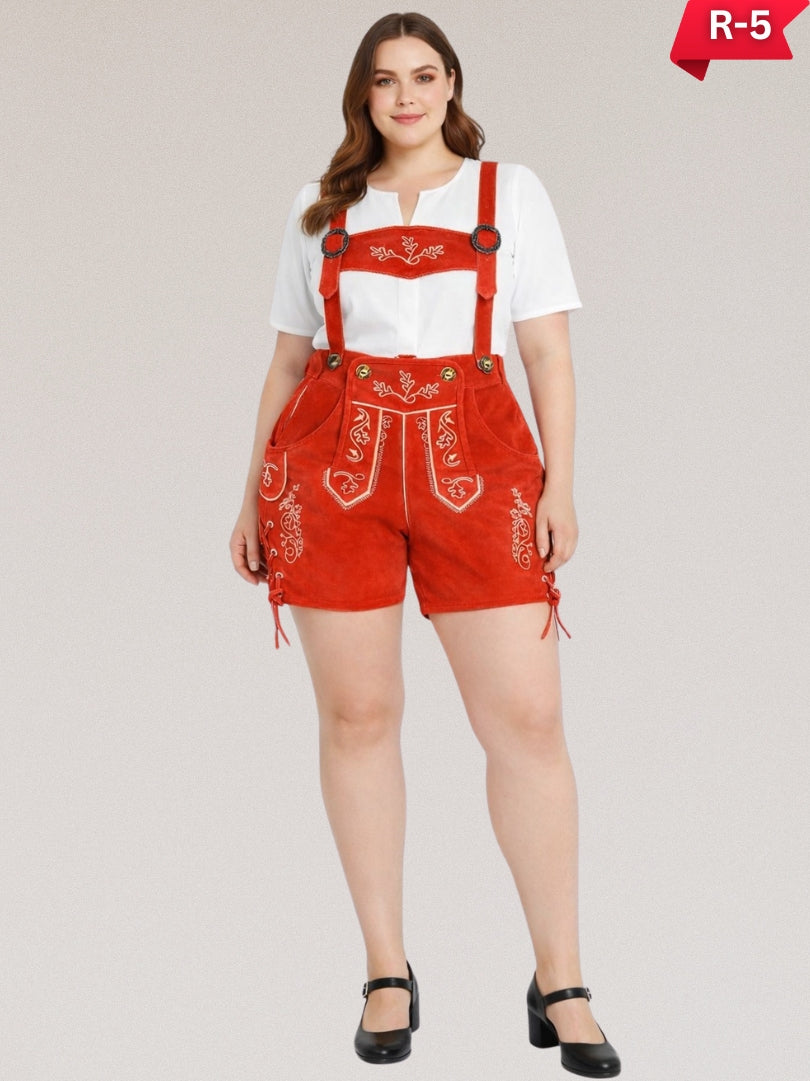 Plus size women wearing red traditional lederhosen with embroidered suspenders, white top, and black shoes, full-length studio image.