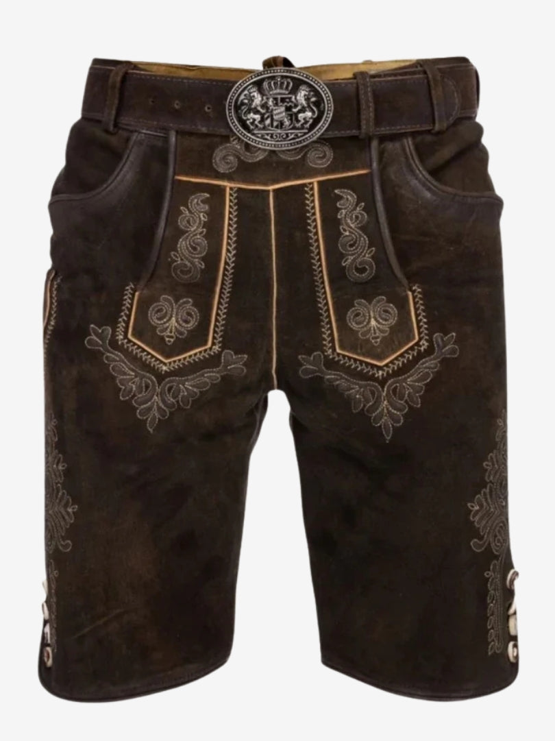Front view of dark brown lederhosen with ornate embroidery, traditional flap design, and belt with engraved buckle.