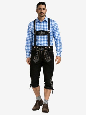 Man wearing black bundhosen with suspenders, paired with a blue checkered shirt, socks, and traditional shoes.