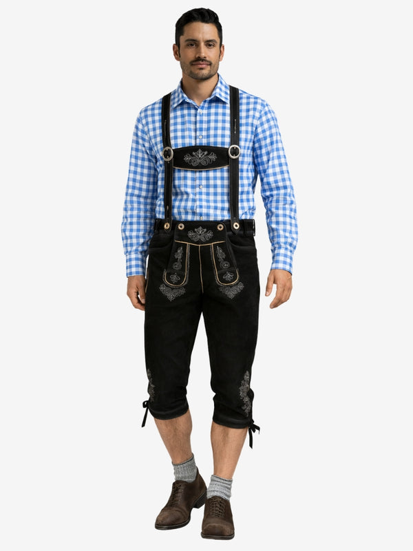 Man wearing black bundhosen with suspenders, paired with a blue checkered shirt, socks, and traditional shoes.