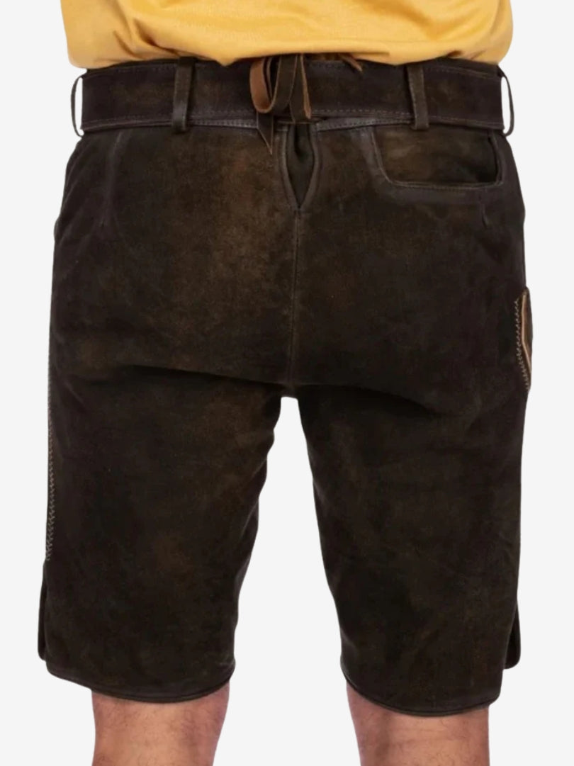 Back view of dark brown lederhosen showing clean finish, belt loops, and structured fit.