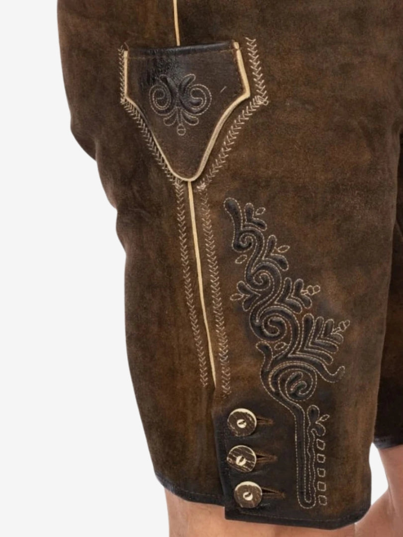 Close-up of lederhosen side panel highlighting intricate embroidery, contrast stitching, and decorative buttons.