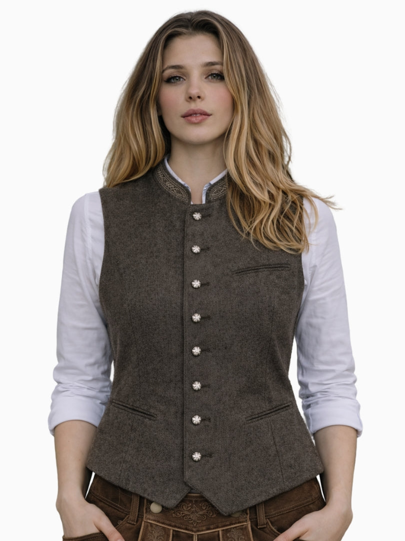 Front view of women's brown wool Bavarian Trachten vest with stand collar, decorative metal buttons, and traditional Alpine design.