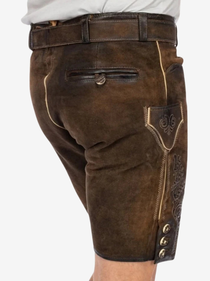 Angled rear view of brown lederhosen showing stitching details, back pocket, and textured leather finish.
