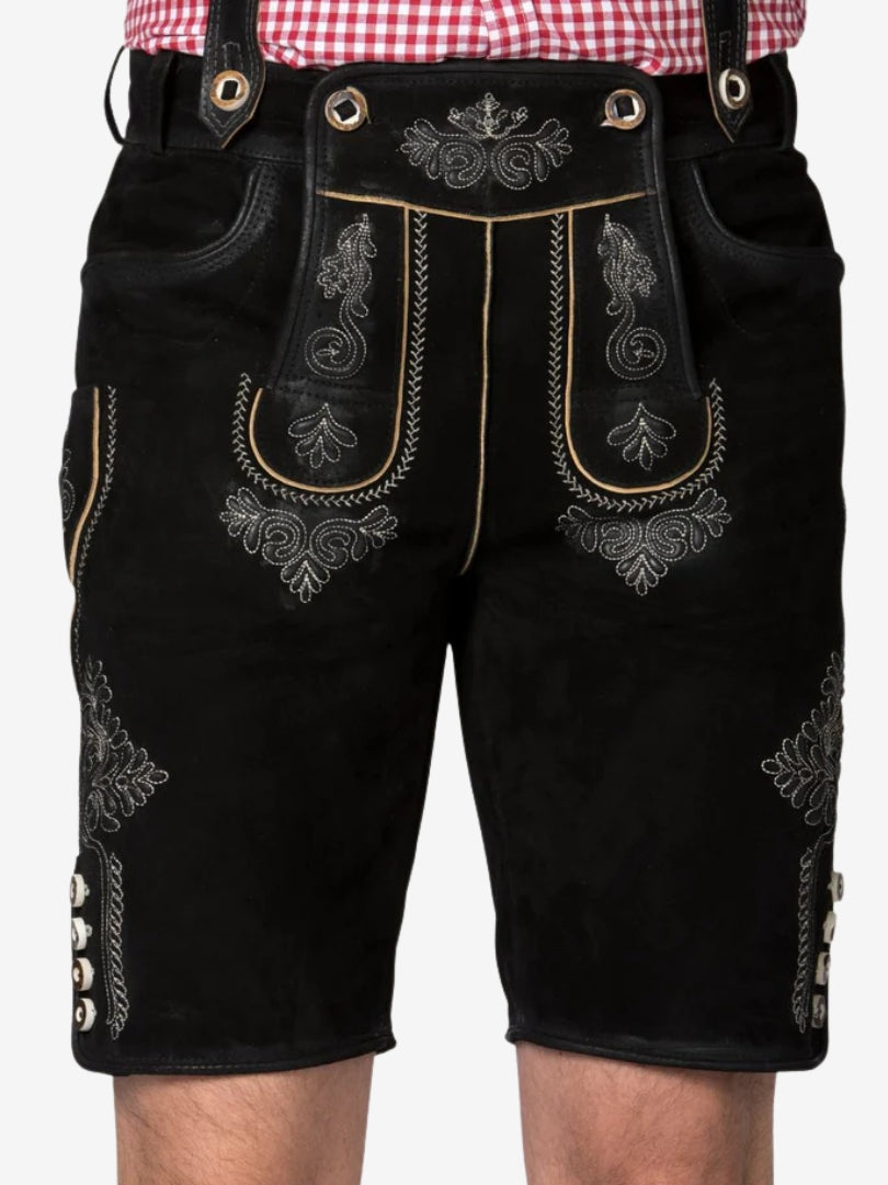 Front view of black lederhosen with intricate white embroidery on the flap and thighs, accented with contrast piping and classic Bavarian detailing.